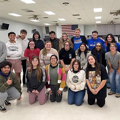 students pose for a large group photo